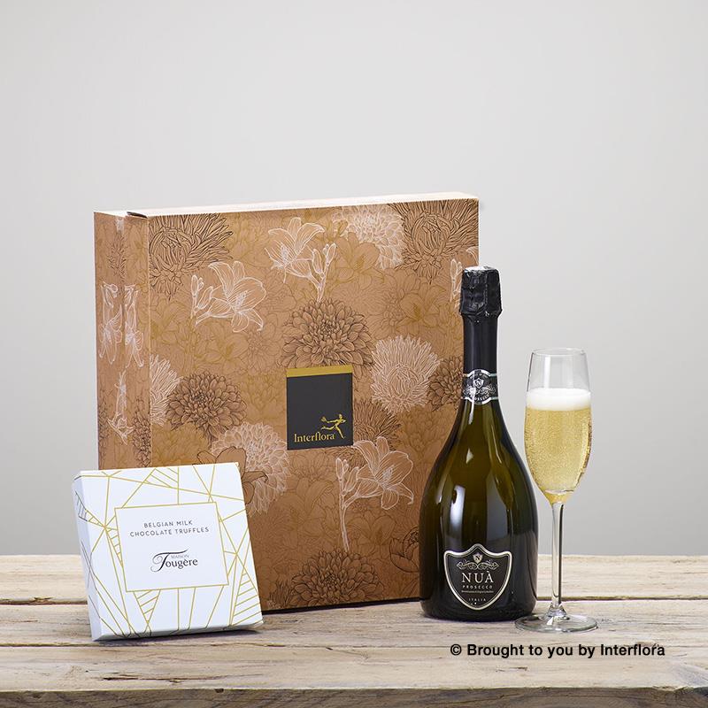 Champagne, truffles and soft baby gift box.